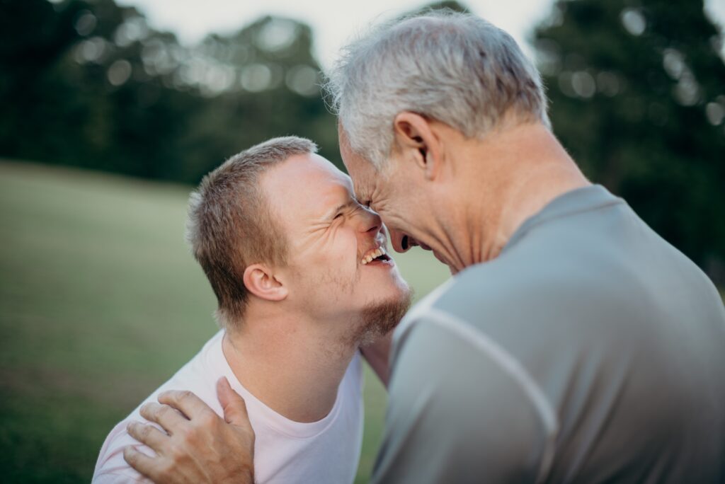 Two men laughing together