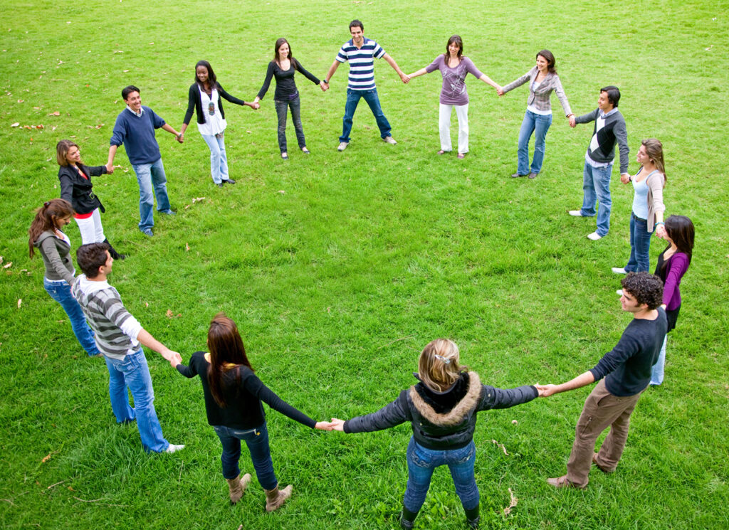 circle of people holding hands