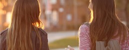 Two women walking and talking