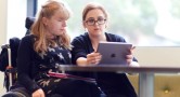 Women looking at an ipad together